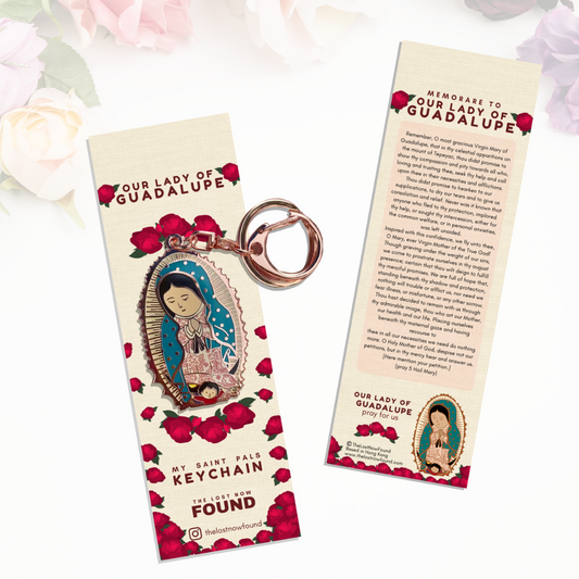 A key chain featuring a bronze-colored Our Lady of Guadalupe together with a bookmark with a prayer and rose designs. 